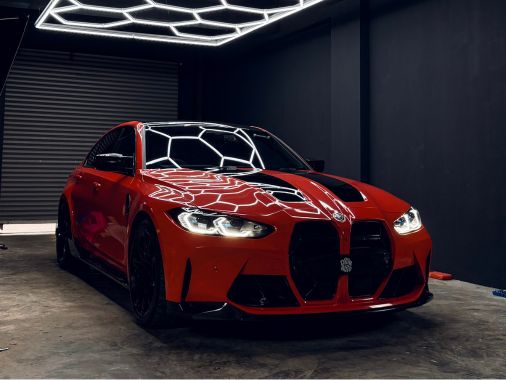 DRVN branded BMWs parked nose to nose